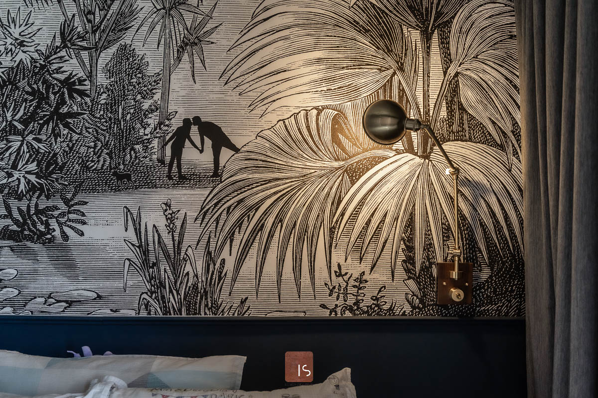 A black and white mural decorates a bedroom at 9 Lorong Lew Lian.