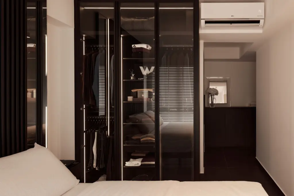 Modern bedroom with glass wardrobe and air conditioning