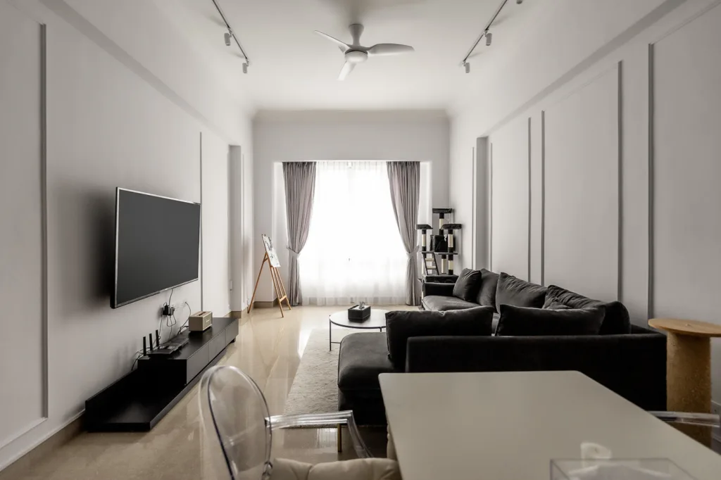 Modern living room with sofa and television.