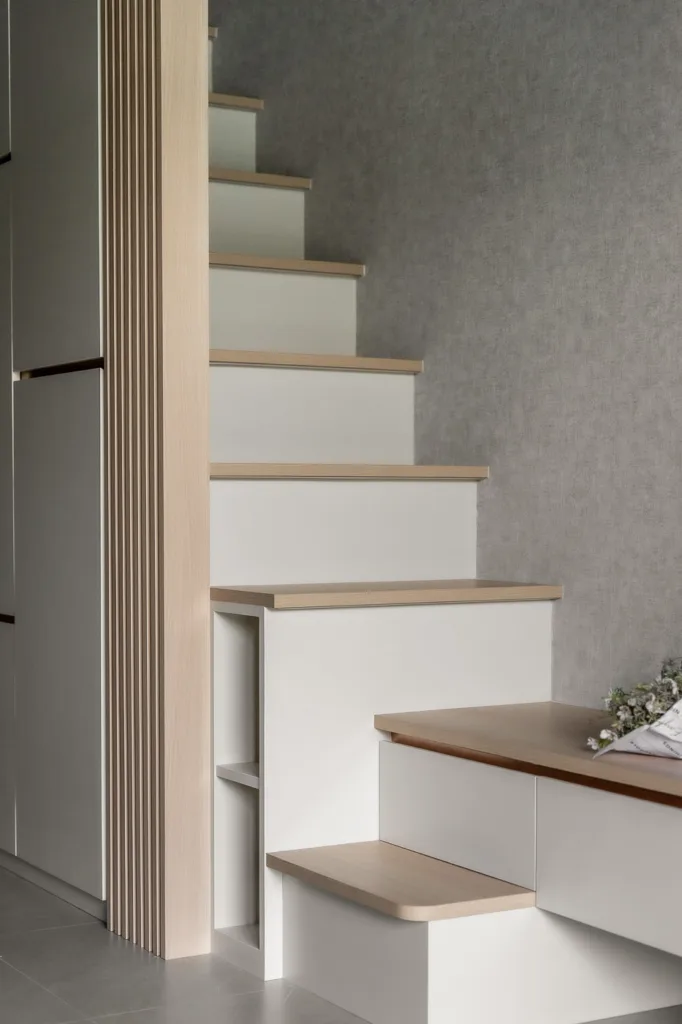 Modern minimalist wooden staircase design in stylish interior