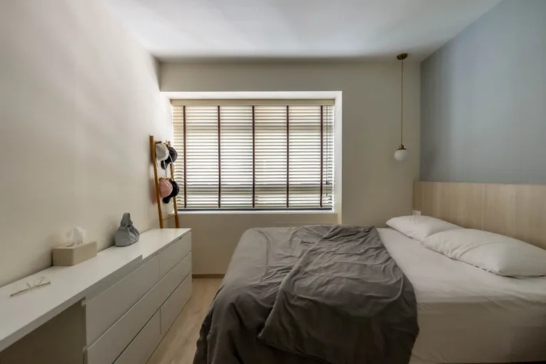 Modern minimalist bedroom interior with natural light.