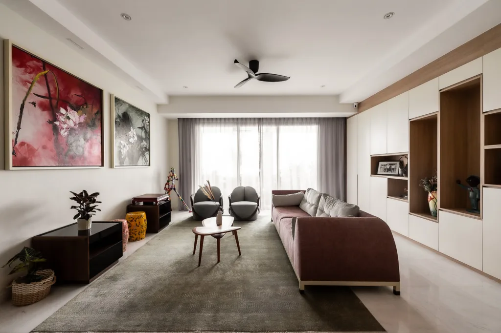 Modern living room with art and minimalist furniture.
