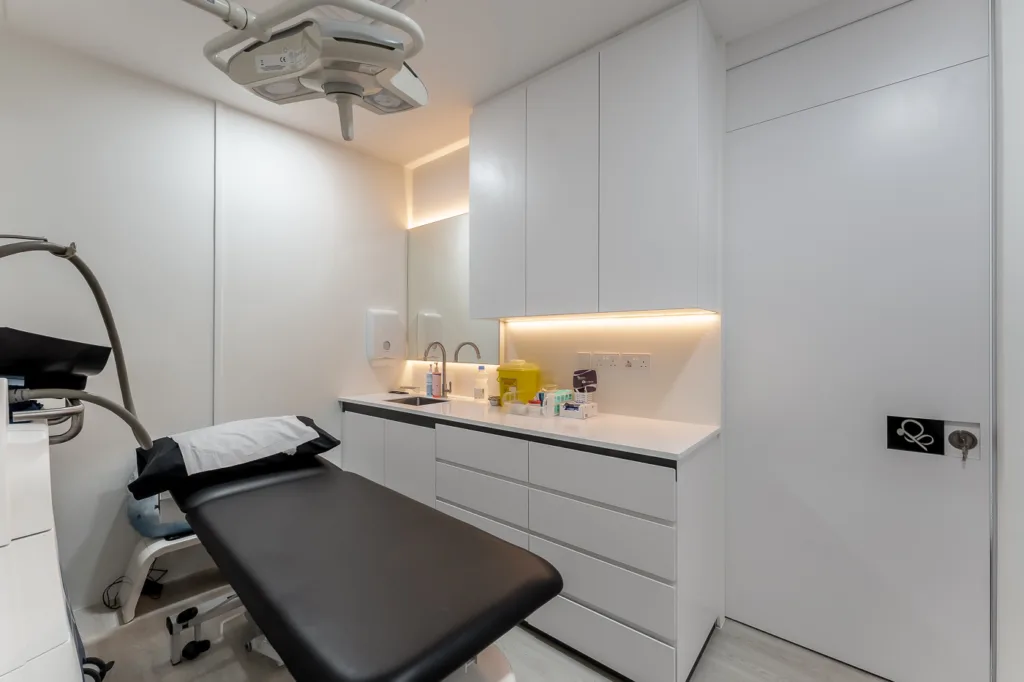 Modern dental clinic interior with exam chair.