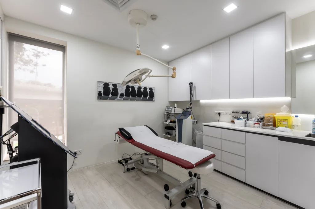 Modern medical examination room with equipment.