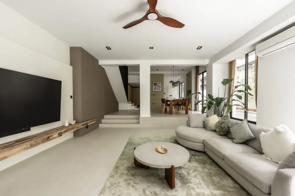 Modern spacious living room with minimalist decor and furniture.