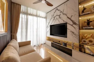 Modern living room with marble wall and mounted TV.