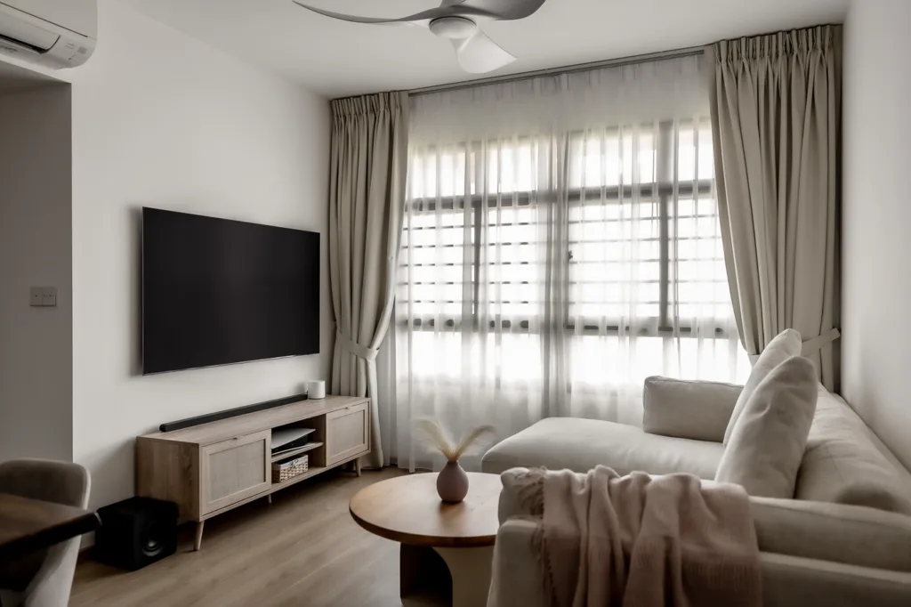 Modern living room with sofa and flat-screen TV.