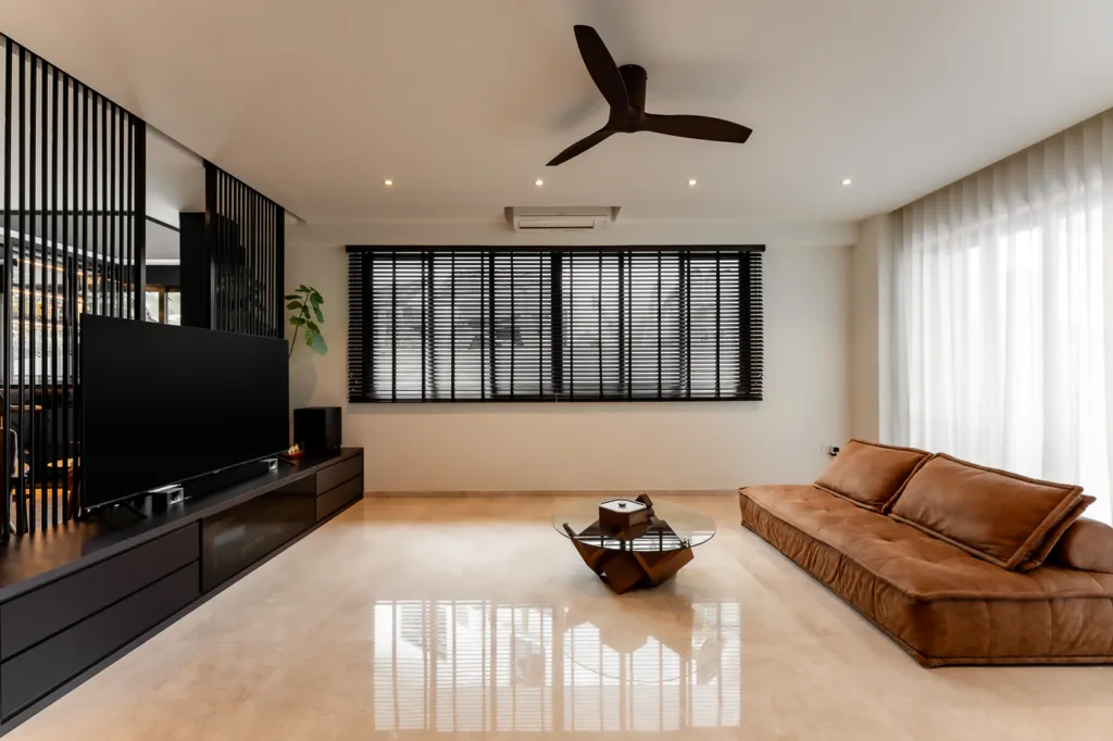 Modern living room with sleek furniture and natural light.