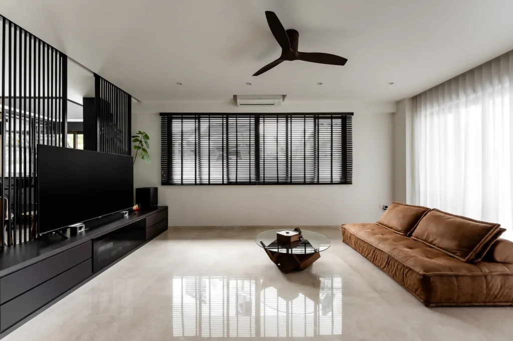 Modern living room with sleek furniture and natural light.