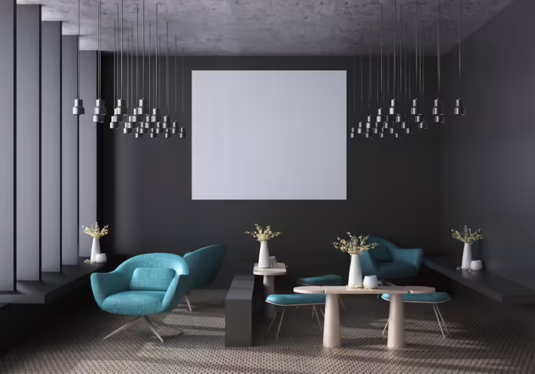 A modern interior design featuring gray walls, teal armchairs, a white square canvas, and multiple pendant lights. The room also includes small tables with vases of flowers. The floor showcases a patterned design, completing the elegant and contemporary look.