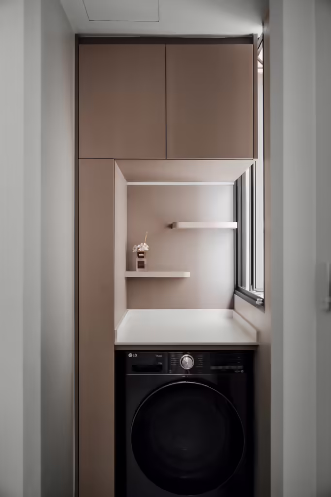 Modern laundry closet at 13 Anchorvale Cres with LG washer and built-in shelving.