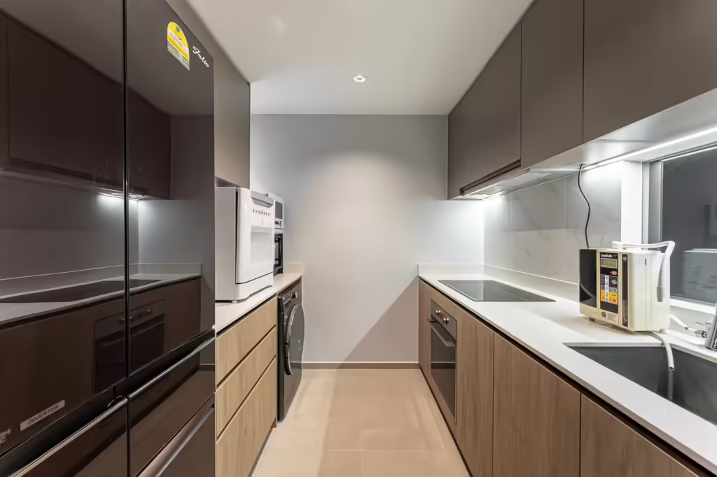 Modern kitchen at 32 Sumang Walk with integrated appliances.