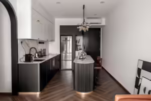Modern black and white kitchen at #16-06 The Viridian, 6 Jalan Ampas. Features marble countertops and a stylish island.