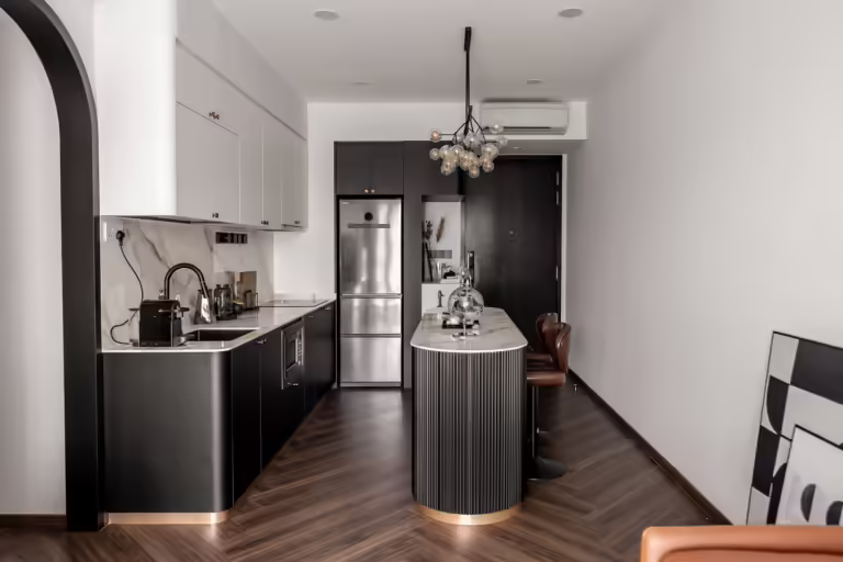 Modern black and white kitchen at #16-06 The Viridian, 6 Jalan Ampas. Features marble countertops and a stylish island.
