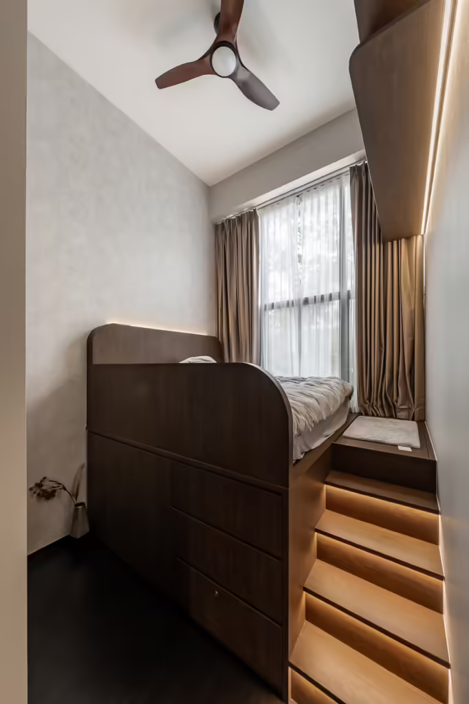 Modern built-in bed with integrated drawers and stairs in a small bedroom.