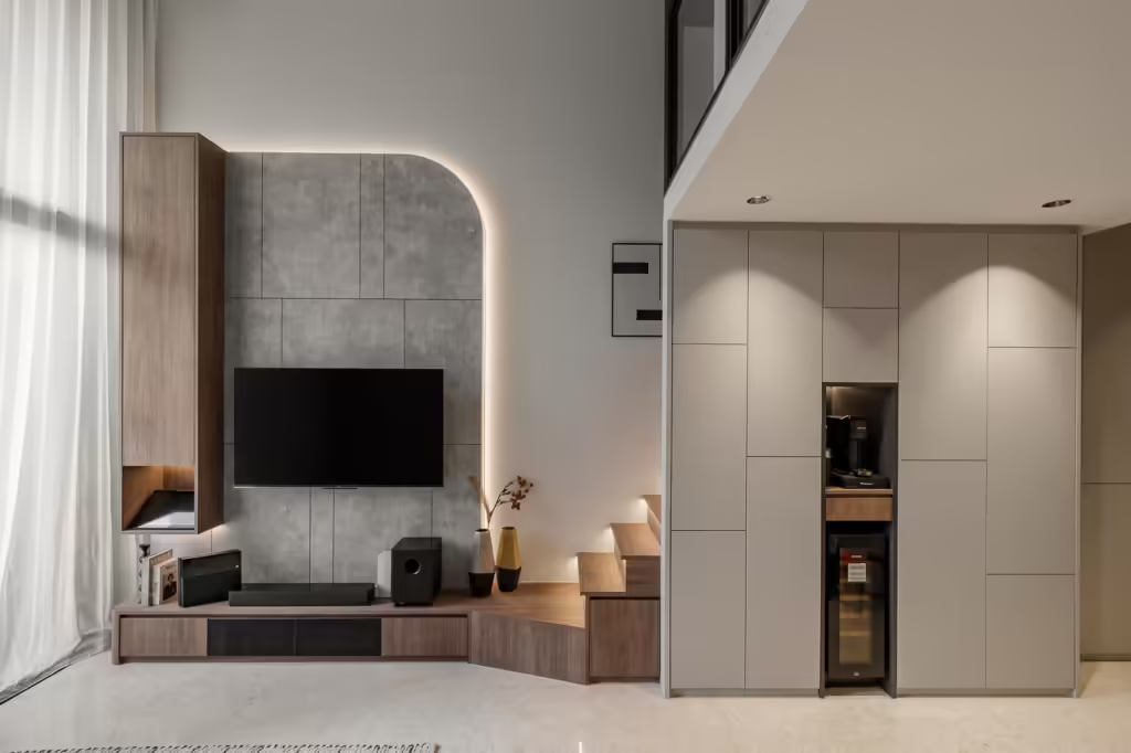 Modern living room with built-in entertainment center and cabinetry.