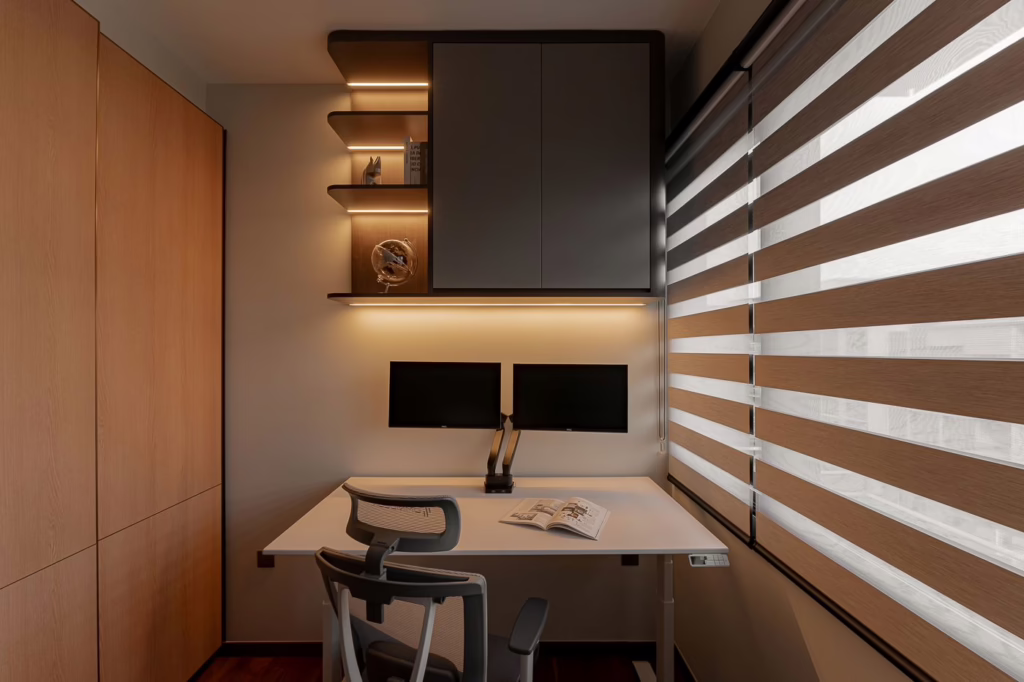 Modern home office with dual monitors, standing desk, and built-in shelving.