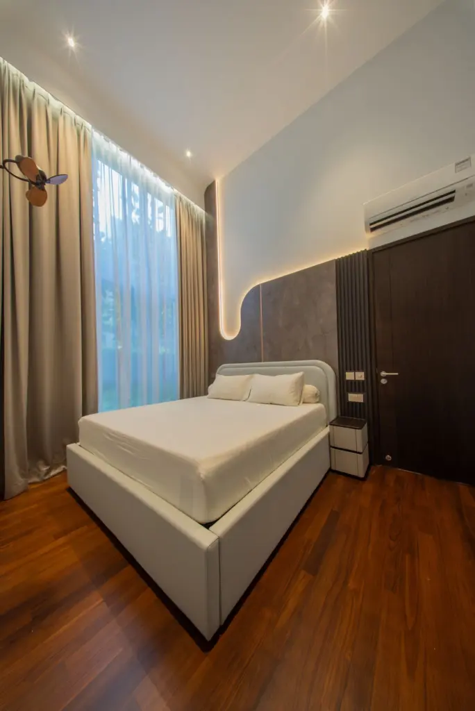 Modern bedroom with bed and wooden floor