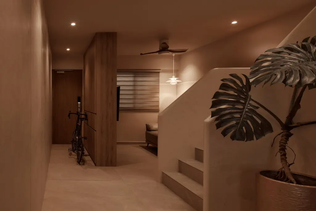 Cozy hallway with bike and staircase decor. — at Kim Keat Avenue, an HDB executive maisonette by IS Design Studio
