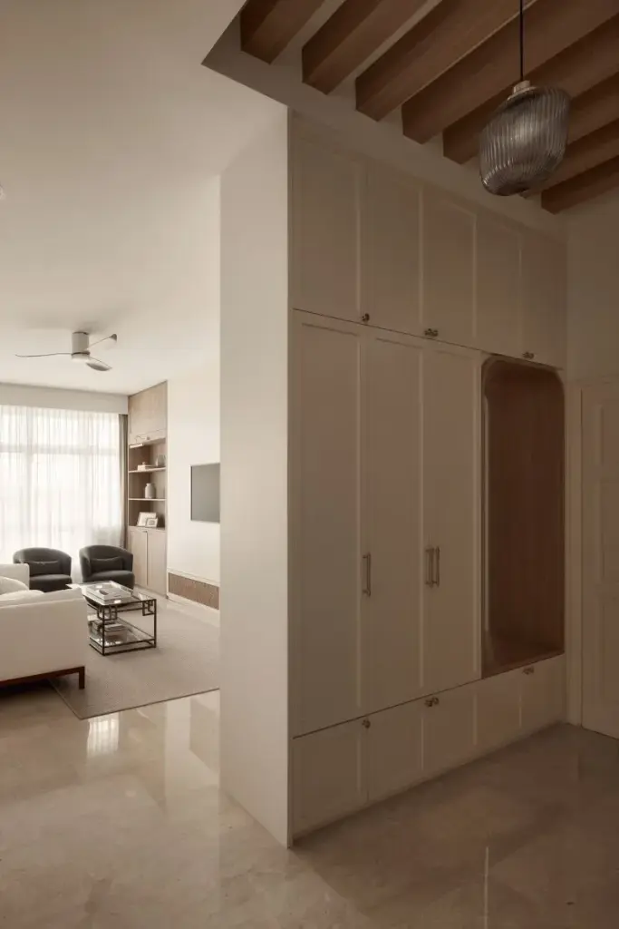 Modern living room with beige cabinets and furniture.