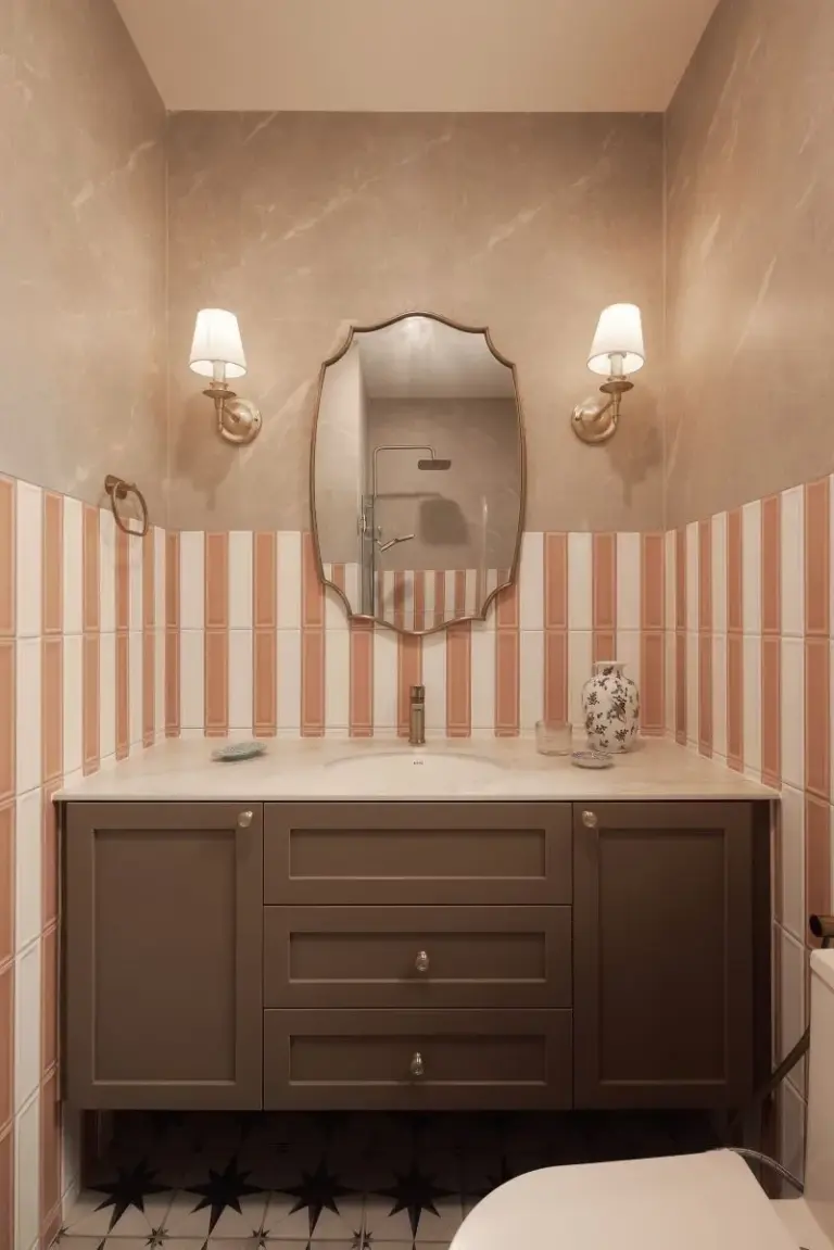 Elegant bathroom with vanity and striped tiles.