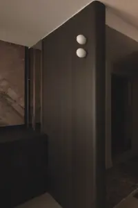 Modern dimly lit hallway with wooden textures.