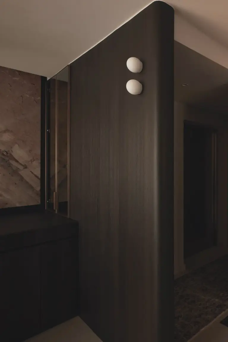 Modern dimly lit hallway with wooden textures.