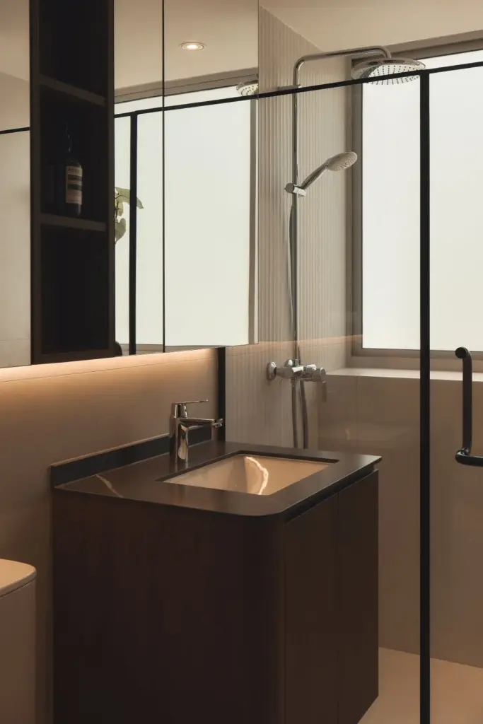 Modern bathroom with glass shower enclosure.