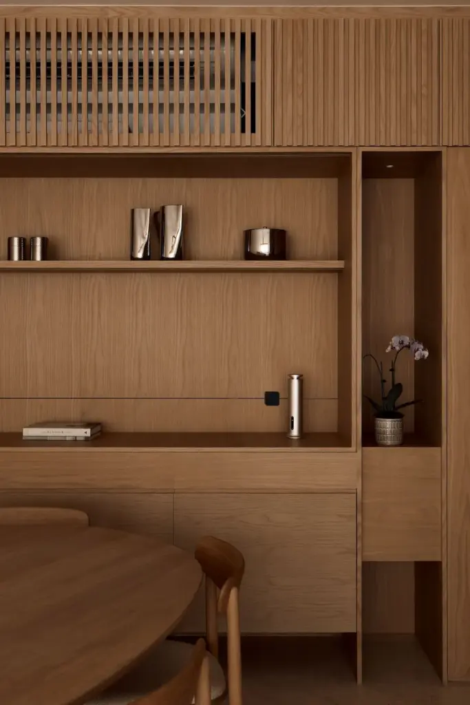 Modern wooden shelves with decor items and plant